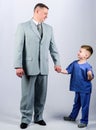 Togetherness. trust and values. fathers day. family day. father and son in business suit. male fashion. happy child with