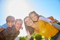 Togetherness is a very important ingredient to family life. a family of four spending time outdoors. Royalty Free Stock Photo