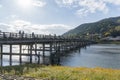 The Togetsukyo Bridge spans the Katsura River in front of Arashiyama Mountain