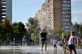 Children play with jets of a fountain on a hot sunny afternoon in the park of the 50th anniversary of JSC AvtoVAZ. Royalty Free Stock Photo