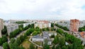 Panorama of residential areas of the summer city in the early morning from the height of the 16th floor of a residential building. Royalty Free Stock Photo