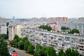 Panorama of residential areas of the summer city in the early morning from the height of the 16th floor of a residential building. Royalty Free Stock Photo