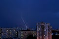 Summer thunderstorm with lightnings over the city night panorama from the height of the 12th floor. Royalty Free Stock Photo