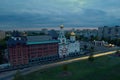 Panorama of the city on an early autumn morning with a view of the Volga Orthodox Institute and the Church of the Three Saints.