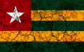 togo country flag painted on a cracked grungy wall