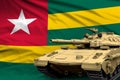 Togo modern tank with not real design on the flag background - tank army forces concept, military 3D Illustration