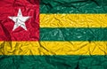 Togo vintage flag on old crumpled paper background