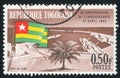 Togolese Flag and Lome Harbour Royalty Free Stock Photo
