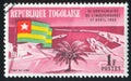 Togolese Flag and Lome Harbour Royalty Free Stock Photo