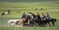 Kyrgyz men play the traditional equestrian game of Kok Boru