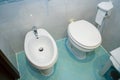Toilet and bidet in the bathroom of a hotel room Royalty Free Stock Photo