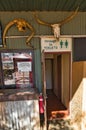 Toilet block decorated with cattle skulls, outback Australia
