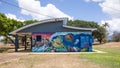 A toilet block decorated with a Great Barrier Reef mural
