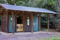 Eungella, Queensland, Australia - August 2020: Toilet block in free camping reserve in tropical rainforest