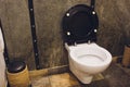 Toilet bowl with bidet shower in toilet. Royalty Free Stock Photo