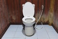 The Toilet bowl with bidet shower in toilet Royalty Free Stock Photo
