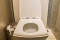 Toilet bowl with full trash bin Royalty Free Stock Photo