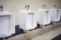 Toilet Bowl urinals for adults and children level, Bowl urinals with white tile background Royalty Free Stock Photo