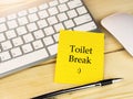 Toilet break with smiley icon on sticky note, office work concept