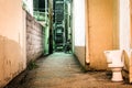 Toilet and dark alley at night in Hanover, Pennsylvania. Royalty Free Stock Photo