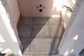 Toilet floor, renovation interior, gray square tile