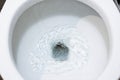 Toilet, Flushing Water, close up, water flushing in toilet Royalty Free Stock Photo