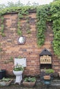 Toilet Garden planter against a brick wall Royalty Free Stock Photo