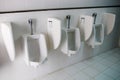 Toilet men`s room.Close up row of outdoor urinals men public toilet,Closeup white urinals in men`s bathroom Royalty Free Stock Photo