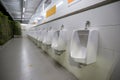 Toilet men`s room.Close up row of outdoor urinals men public toilet,Closeup white urinals in men`s bathroom Royalty Free Stock Photo