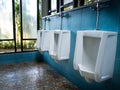 Toilet men`s room.Close up row of outdoor urinals men public toi Royalty Free Stock Photo