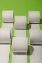 Toilet paper concept on green background. Hygiene and health. Co