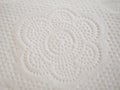 Toilet paper flower pattern embossed on white paper texture Royalty Free Stock Photo