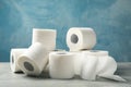 Toilet paper on grey table Royalty Free Stock Photo