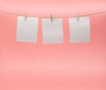 Toilet paper hanging to dry on a clothesline on a pink background. The concept of saving money
