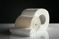 Toilet paper with medical bandage and gauze rolls on white table Royalty Free Stock Photo