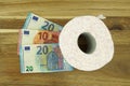 Toilet paper roll with Euro banknotes. Royalty Free Stock Photo