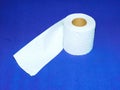 Toilet paper roll on purple background Royalty Free Stock Photo