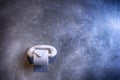 Toilet paper roll in restroom.Paper roll with cement wall background