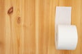 Toilet paper roll on a wood table Royalty Free Stock Photo