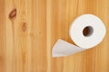 Toilet paper roll on a wood table Royalty Free Stock Photo