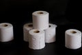 Toilet paper rolls against a black background Royalty Free Stock Photo