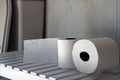 Toilet paper rolls on top of a table in the bathroom. Royalty Free Stock Photo