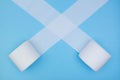 Toilet paper rolls uncoil across diagonal on a blue background. Do not panic. Stay home Royalty Free Stock Photo