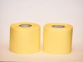 toilet paper, ywo tissue yellow paper rolls isolated on white background