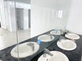 Toilet room for men with urinals sinks and mirrors Royalty Free Stock Photo