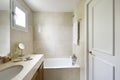 Toilet with shower cabin, cream-colored marble tiles and countertop Royalty Free Stock Photo