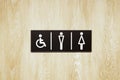 Toilet sign and direction on wood wall Royalty Free Stock Photo