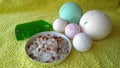 Toiletries bath soap, bath salt and bath bombs of different sizes on a towel Royalty Free Stock Photo