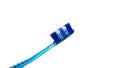 Toiletries of blue toothbrush with soft bristles on white background