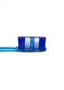 Toiletries of blue toothbrush with soft bristles on white background